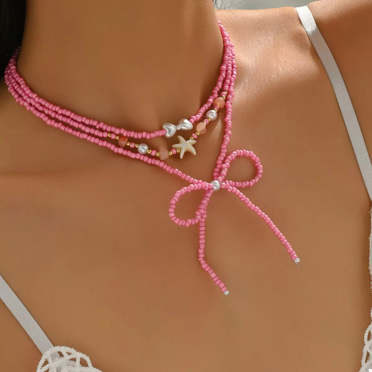 Beaded Three-Layered Necklace with Bow and Starfish Charms