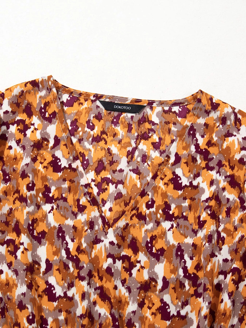 Abstract Print V Neck Smocked Babydoll Blouse