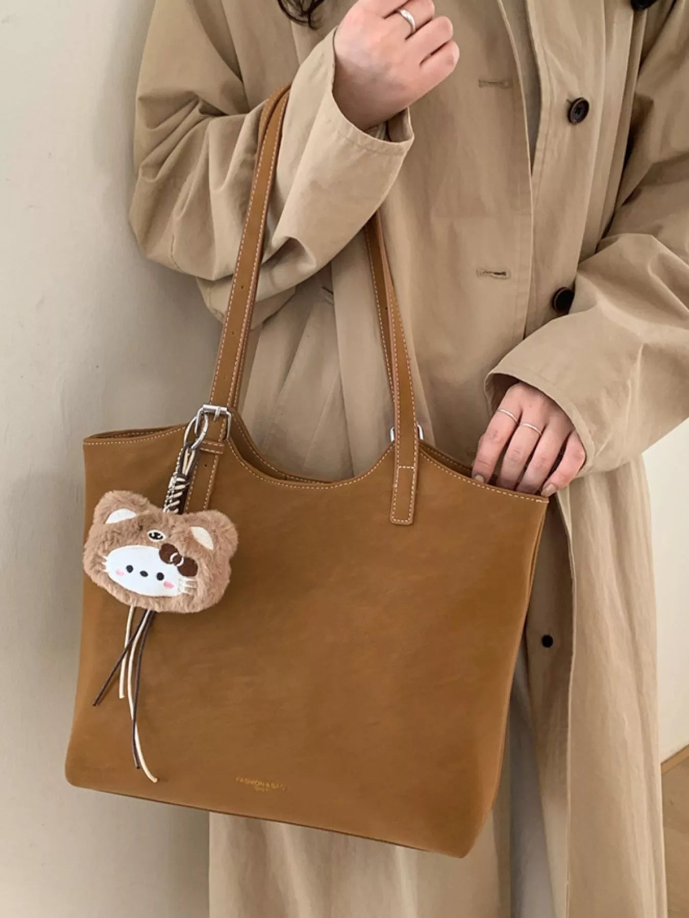 Solid Color Handbag with Plush Charm