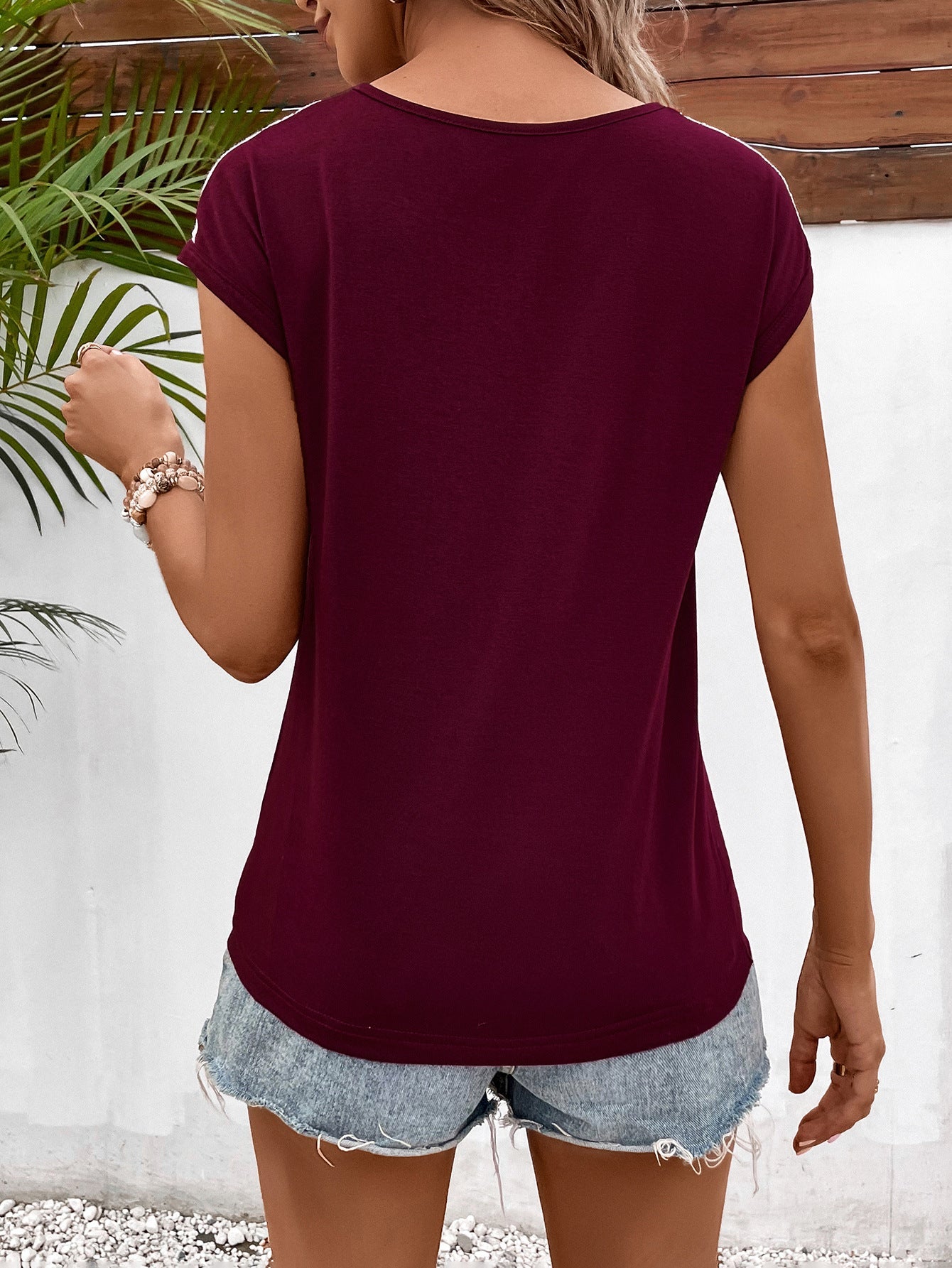 Ivy Lane Spliced Lace V-Neck Twisted Hem Tee