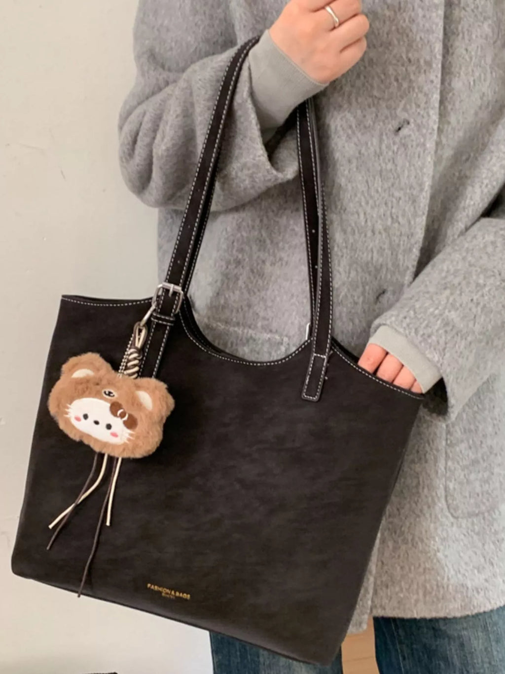 Solid Color Handbag with Plush Charm