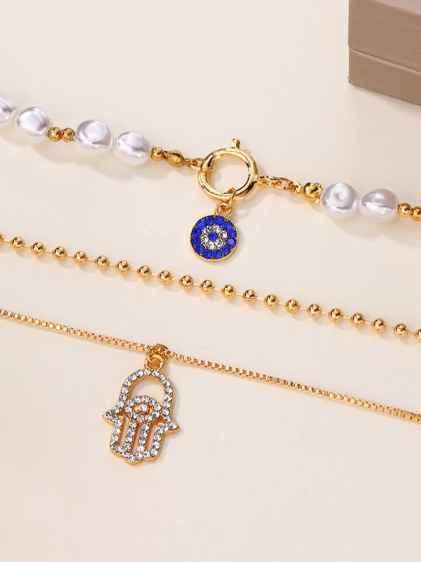 Layered Pearl Chain Evil Eye Hamsa Pendant Necklace