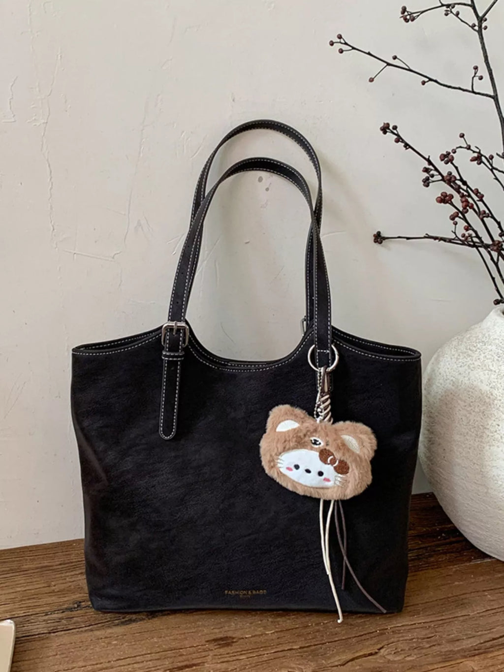 Solid Color Handbag with Plush Charm