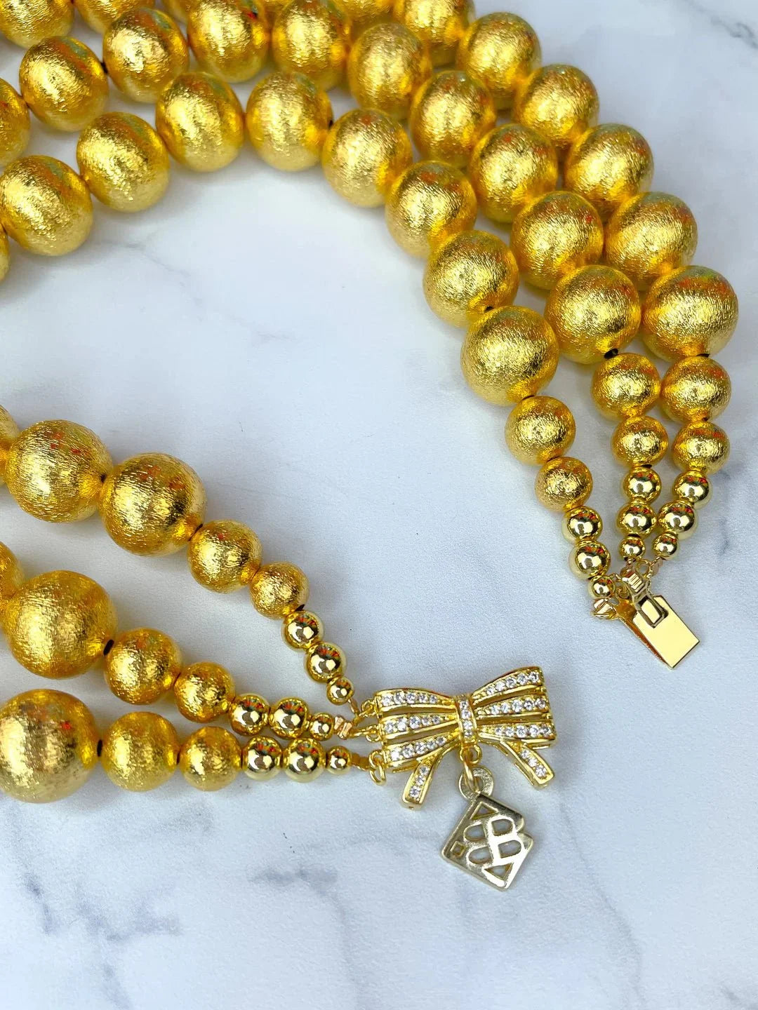 BRIANNA CANNON - 
3 Strand Gold Beaded Brianna Necklace