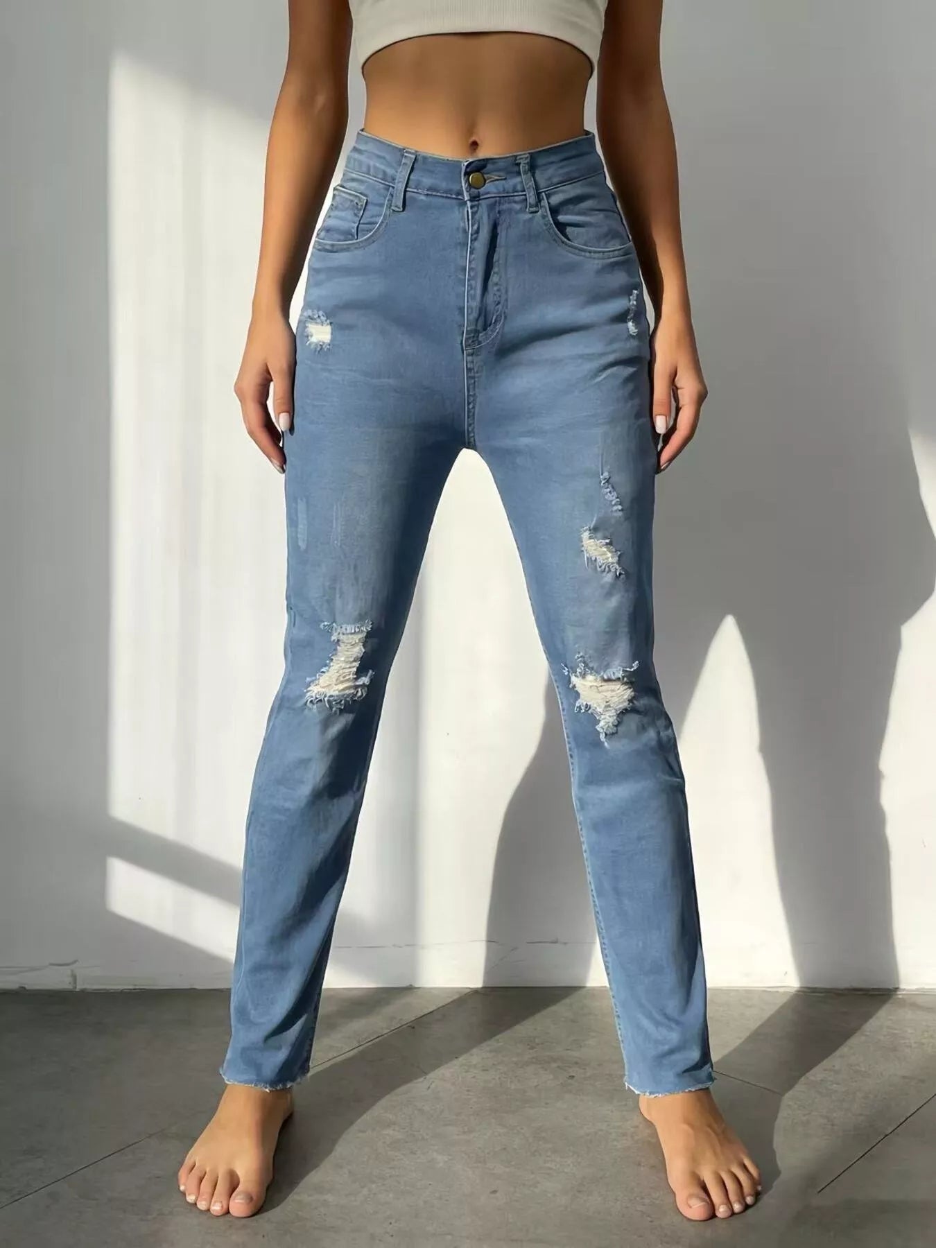 High-Waisted Distressed Jeans