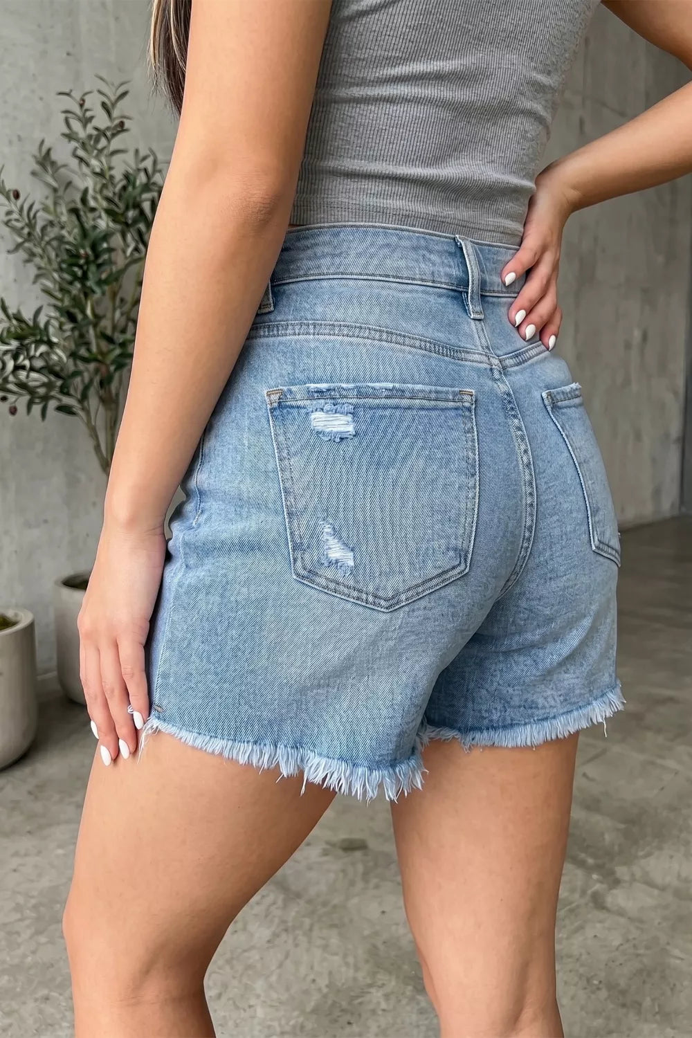 Asymmetric Raw Hem Distressed Whiskery Denim Shorts