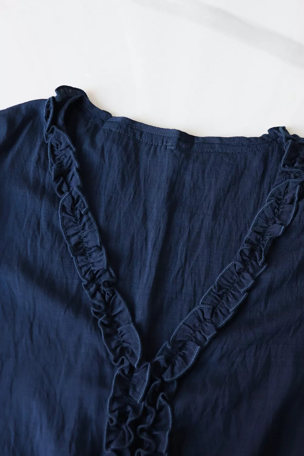 Ruffle Hem Tie Neck Blouse