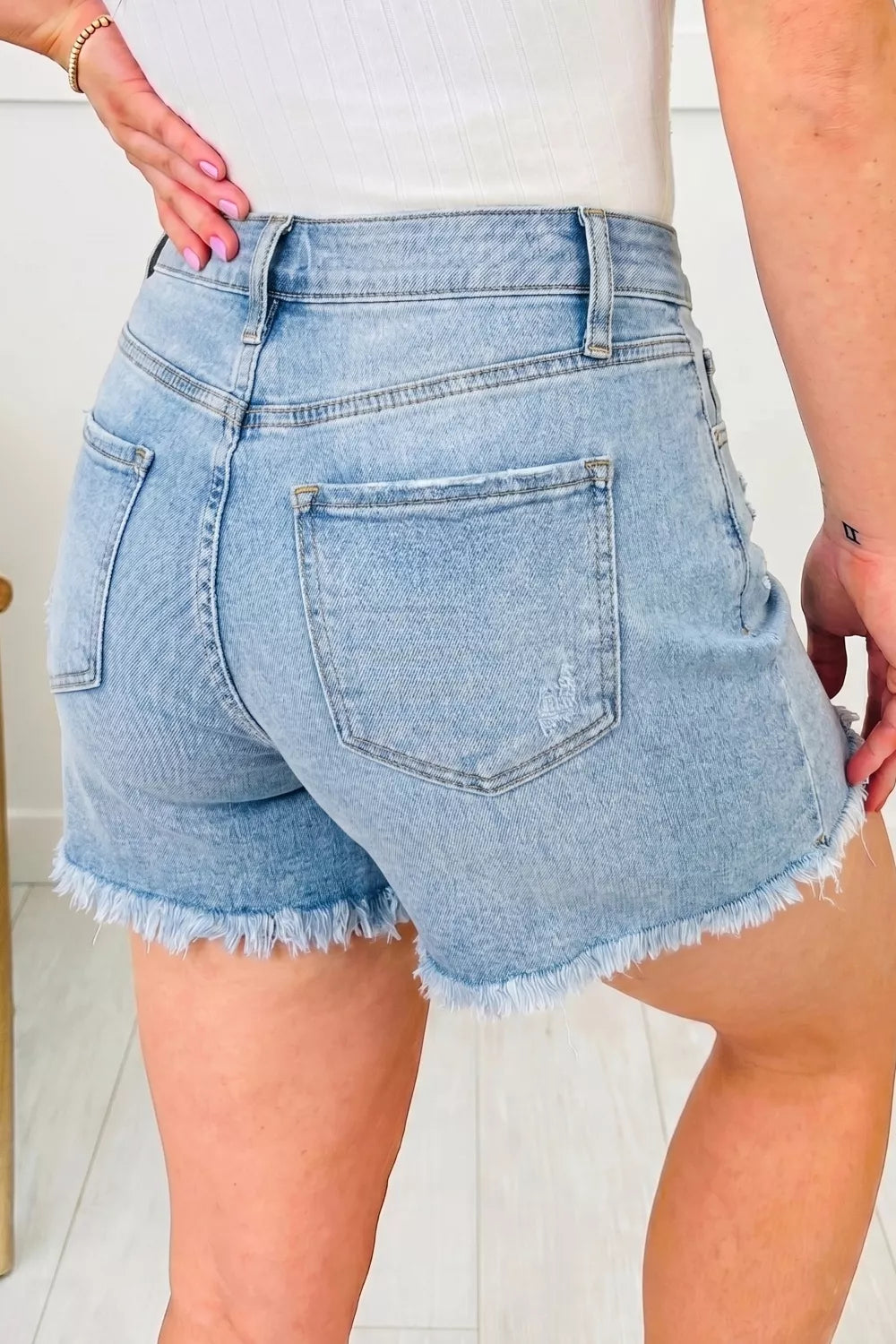 Asymmetric Raw Hem Distressed Whiskery Denim Shorts