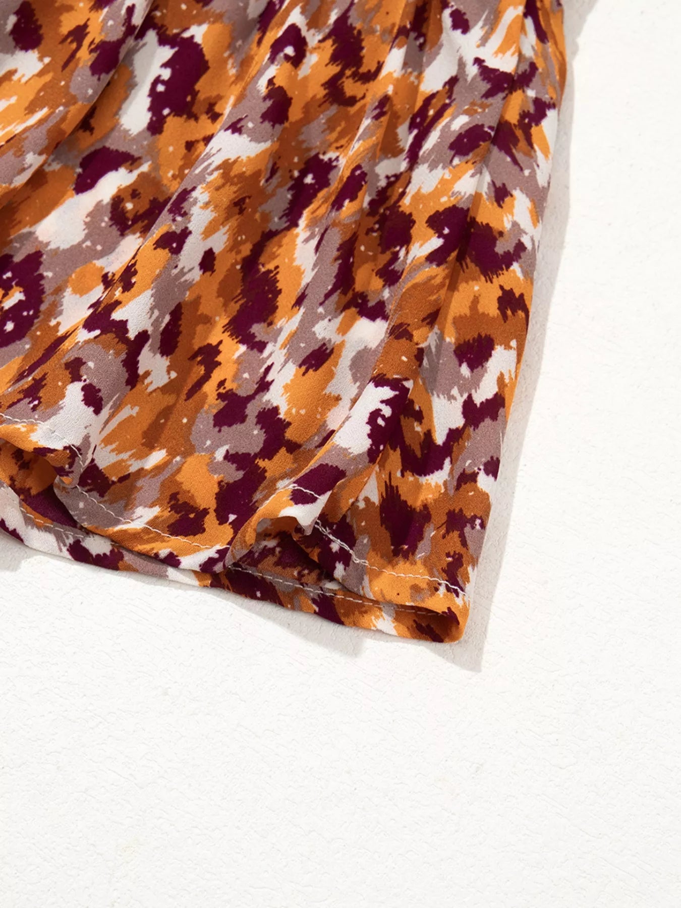 Abstract Print V Neck Smocked Babydoll Blouse